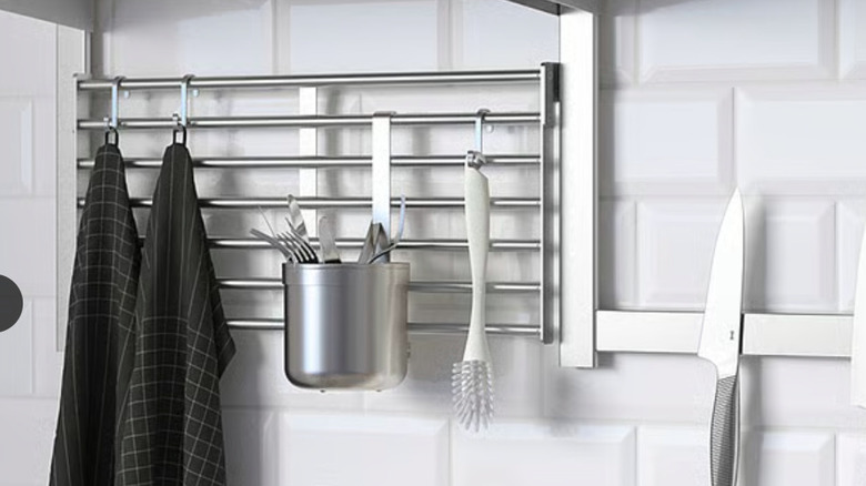A wall rack holding kitchen essentials.