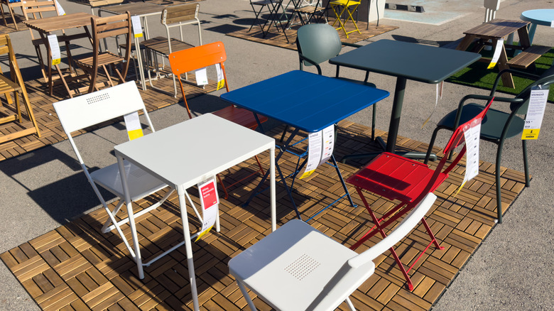 Outdoor furniture display featuring tables and chairs at an IKEA store