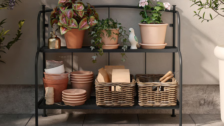 The Lӓckӧ indoor/outdoor shelving unit with plants and baskets on it