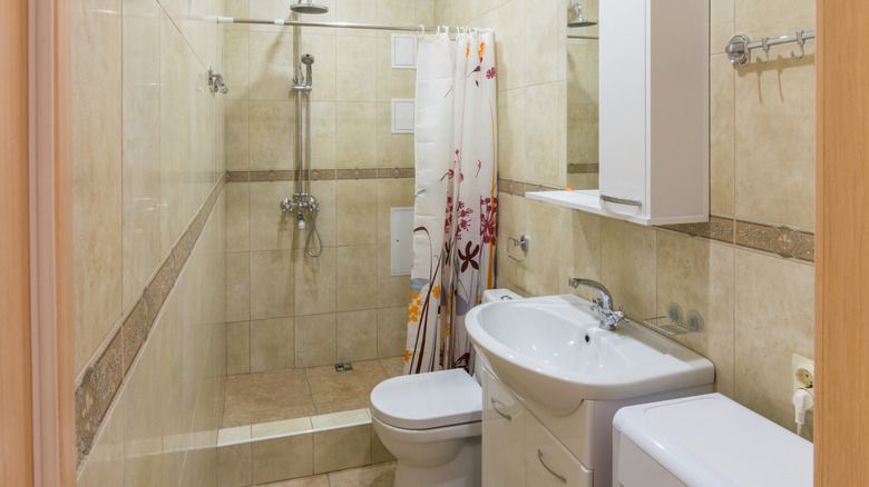 A small but modern, tiled bathroom