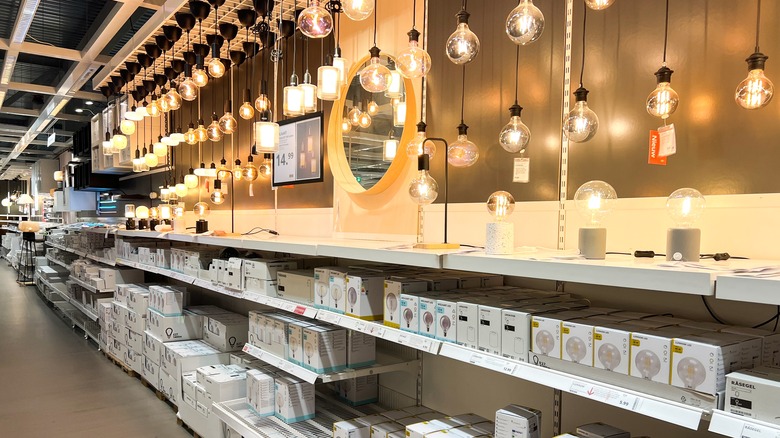 Shelves in an IKEA store showcasing home lighting equipment
