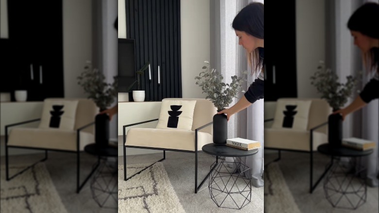 Creator assembling the table and the finished product styled with books, a mug, and a lamp