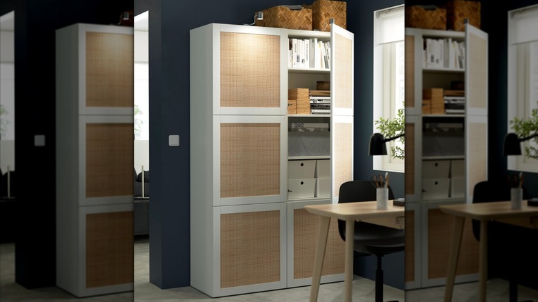 IKEA BESTÅ in white Studsviken/white woven poplar holding bins and books inside