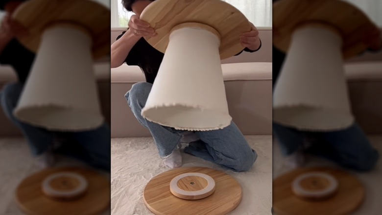 Person making a DIY side table using IKEA products