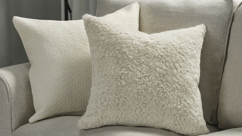 IKEA's NÄTNÄVA cushion cover on a beige sofa