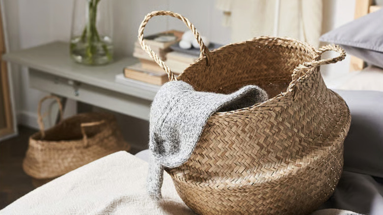 IKEA's FLÅDIS basket sitting on a sofa in a living room