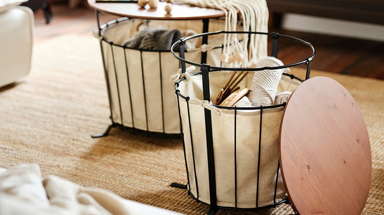 wire basket with fabric liner and wood top, holding knitting supplies