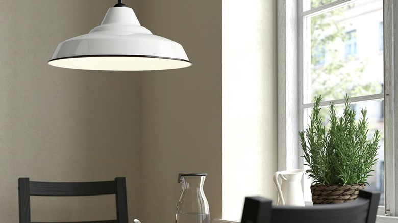 white pendant light next to a window
