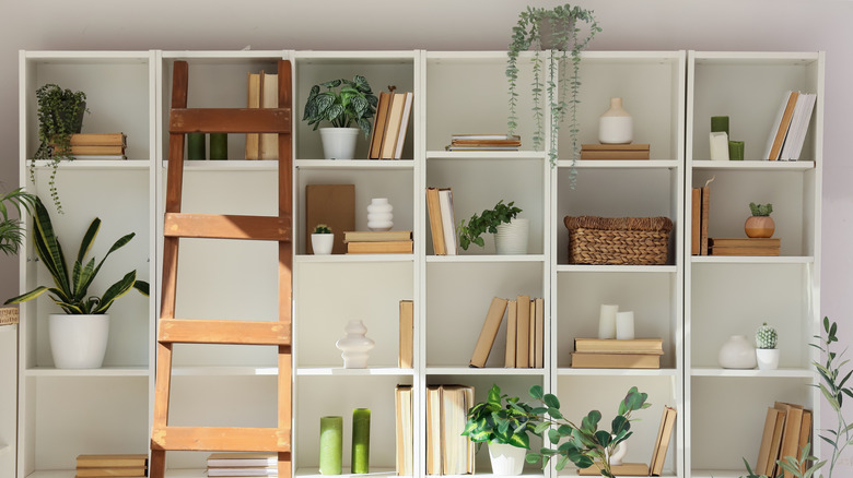 interior of a home with stacking shelving units for storage