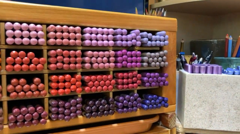 A wooden colored pencil organizer