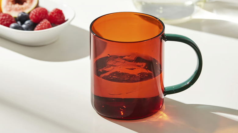 An IKEA SKUGGSTUBB mug on a table