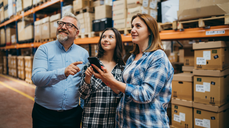 Shoppers locating an item in IKEA warehouse