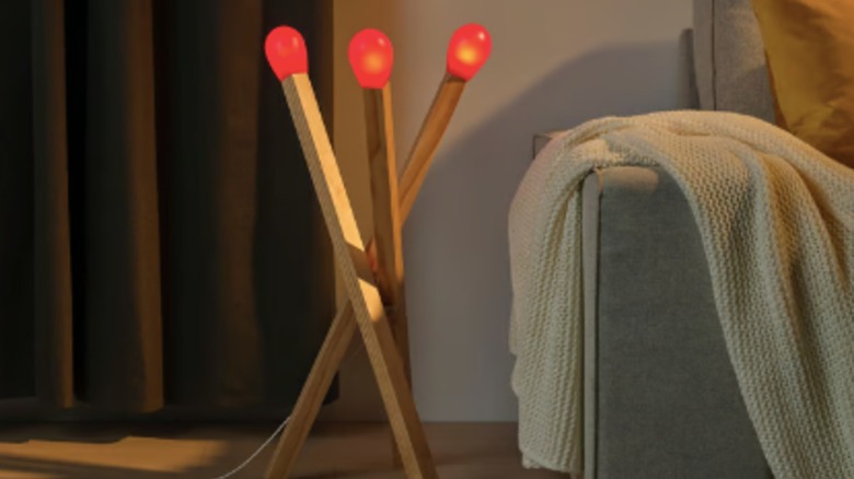 IKEA's. unique matchstick-like STRÅLA LED floor lamp in a living room