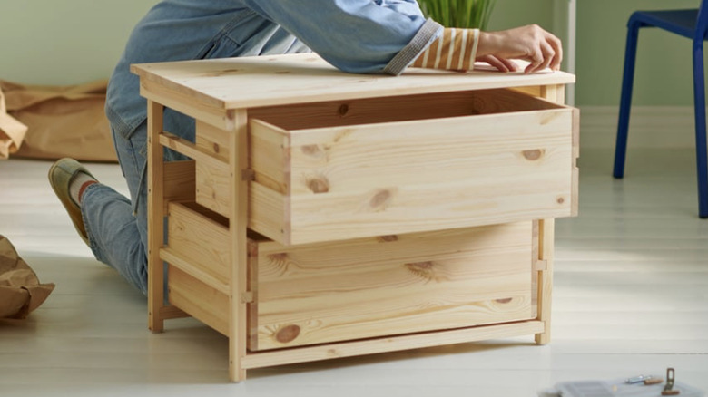 Someone working on the IKEA KRONÖREN