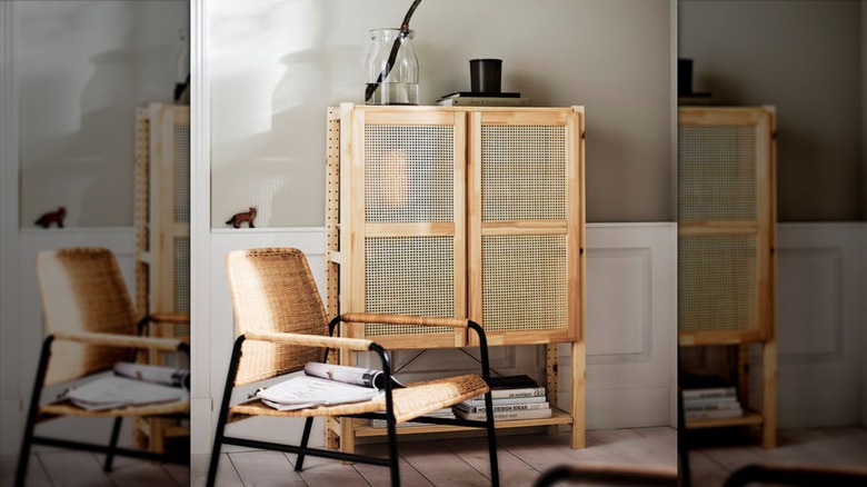IKEA IVAR shelving unit with doors in a living room setting