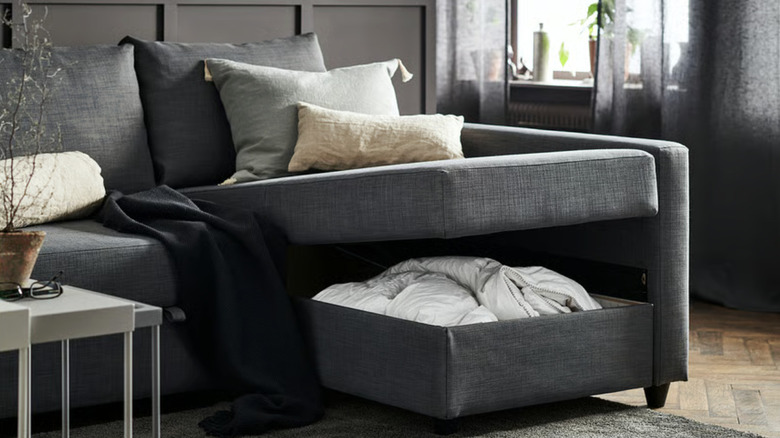 A sleeper sectional with an open chaise showing included storage