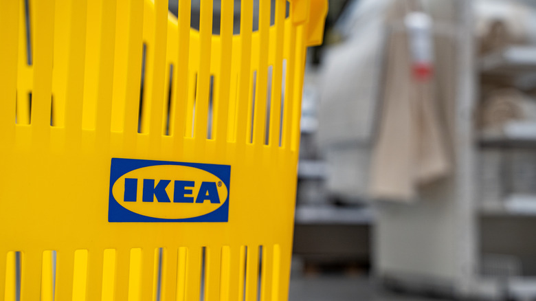A yellow shopping cart in an IKEA store