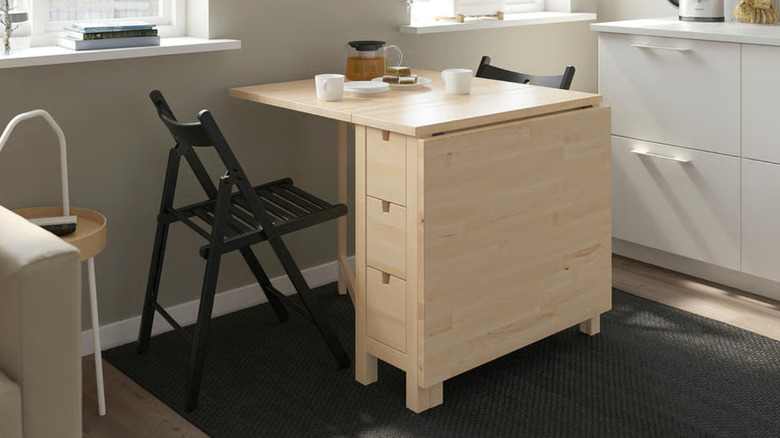 A birch folding table in a small kitchen