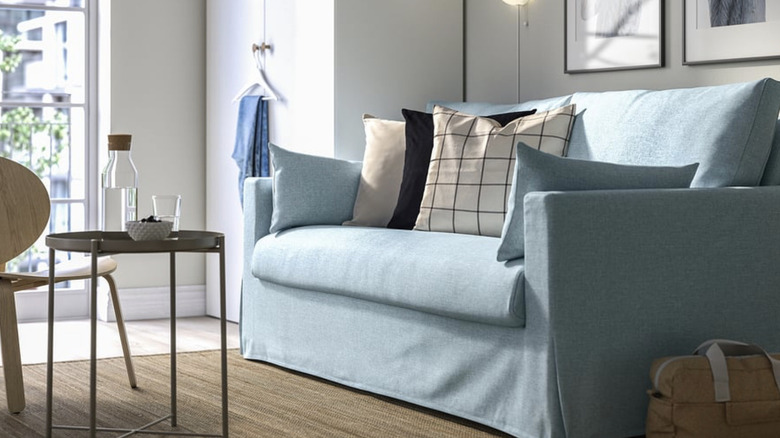 IKEA HYLTARP loveseat in a white and beige room