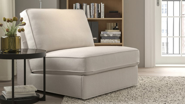 IKEA KIVIK 1-seat sleeper sofa in a beige room