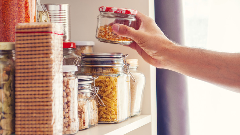 placing food on white shelf