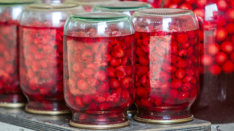 Unsafe canning practice of jars of cherries flipped upside down to seal jars