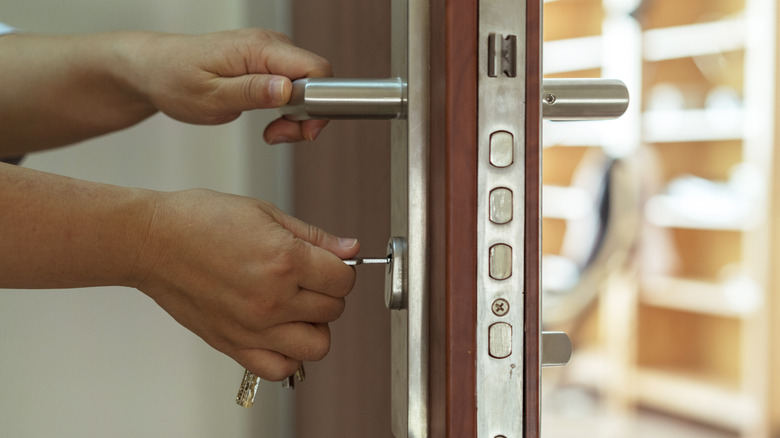 hands locking door