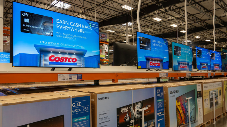 A row of TVs displayed at Costco