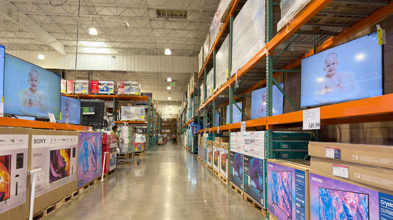 TVs on display in a Costco store aisle