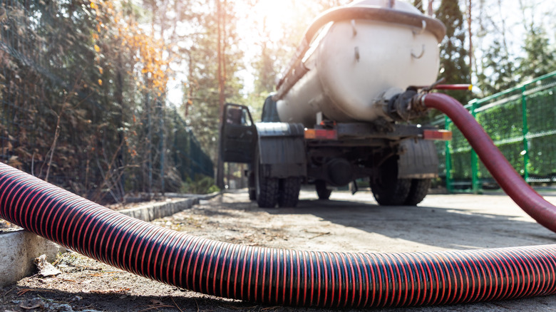 pumping a septic tank with a truck