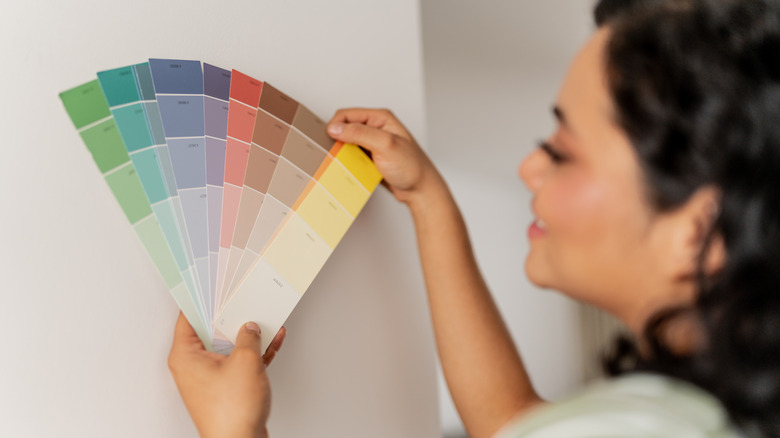 Person looking at paint sample colors