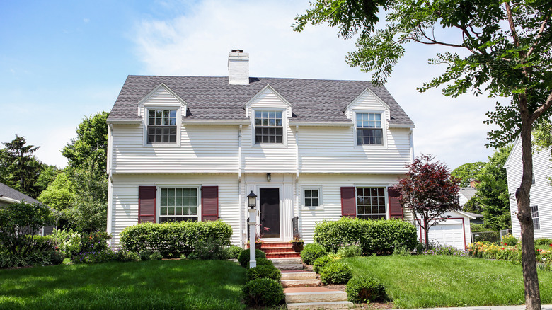 A Cape Cod-style home with that's been upgraded with dormers