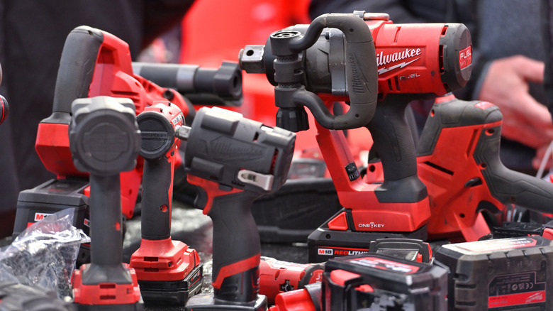Person looking at Milwaukee power tools