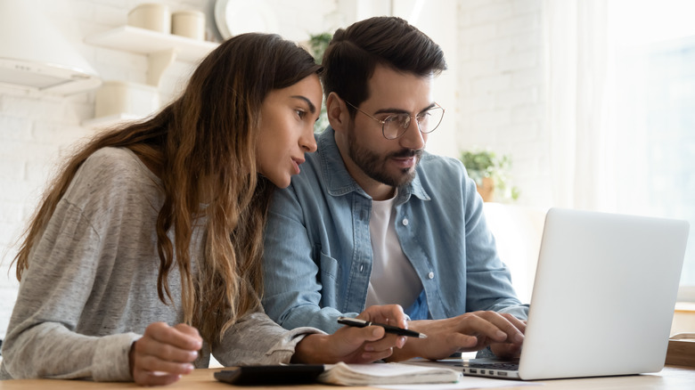 Couple looking at computer