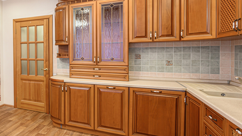 Honey oak wood kitchen cabinetry.
