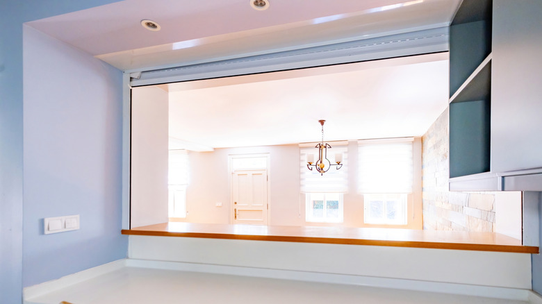 A pass through window from the kitchen into the living room