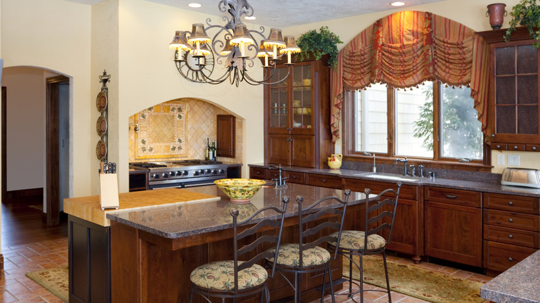 A large 2000s Tuscan style kitchen.