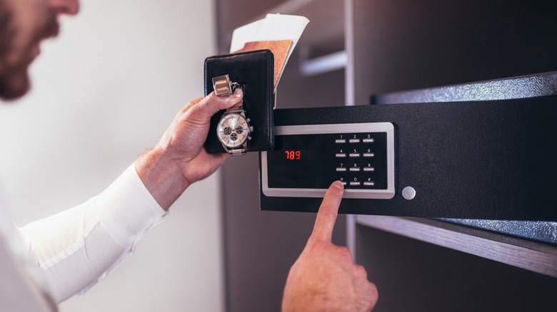 man writing a safe's code