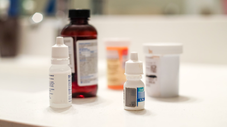 Different types of medication on a bathroom counter