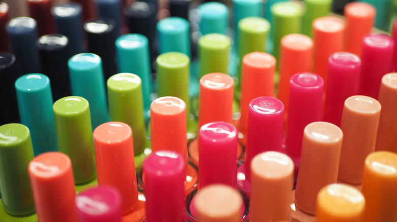 colorful nail polish lined up in rows
