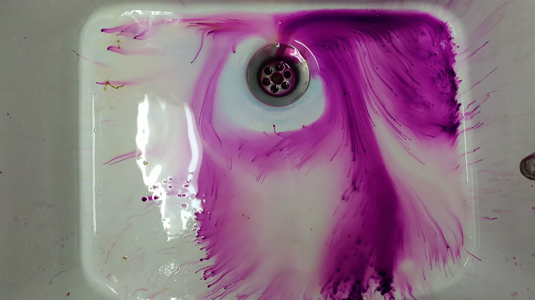 purple liquid substance on sink 