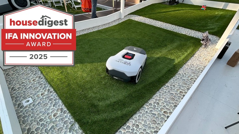 Photo of ANTHBOT Genie mowing a lawn beside House Digest IFA Innovation Award badge