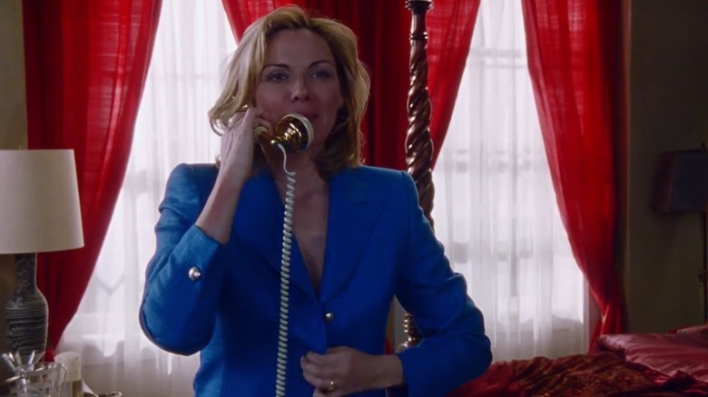 Sex and the City character Samantha Jones in her blue-lit kitchen