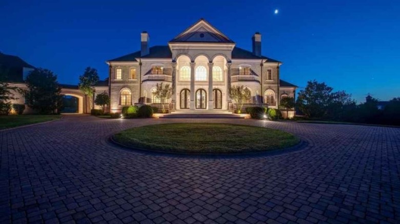 Large mansion exterior at night