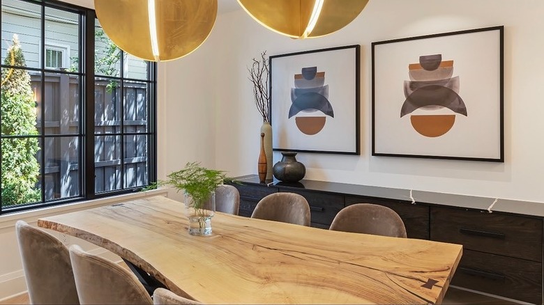 A small dining room with a wooden table.