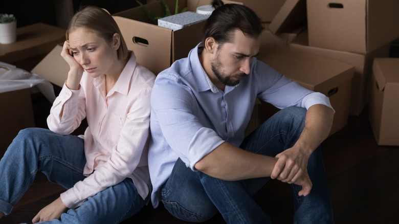 Disappointed people with boxes