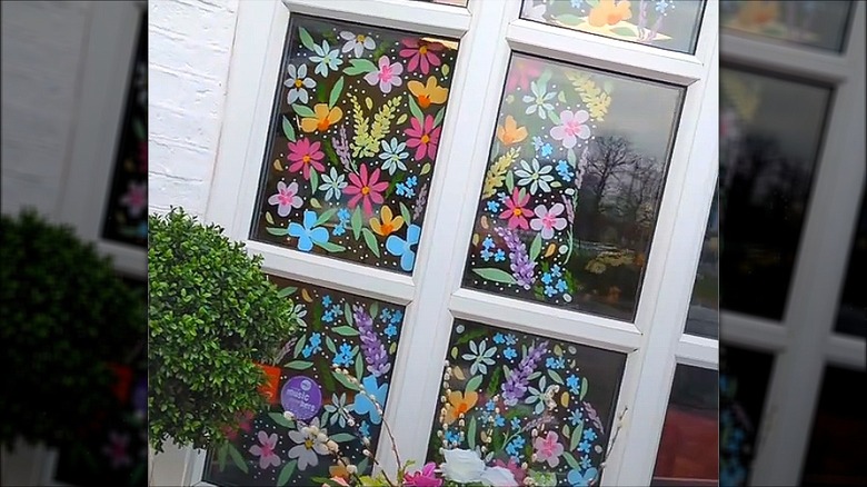 Colorful flowers painted onto window