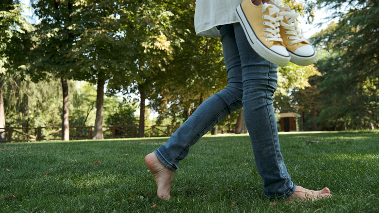 A person walking on grass