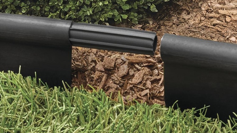 Cylindrical plastic landscape edge connector piece in action