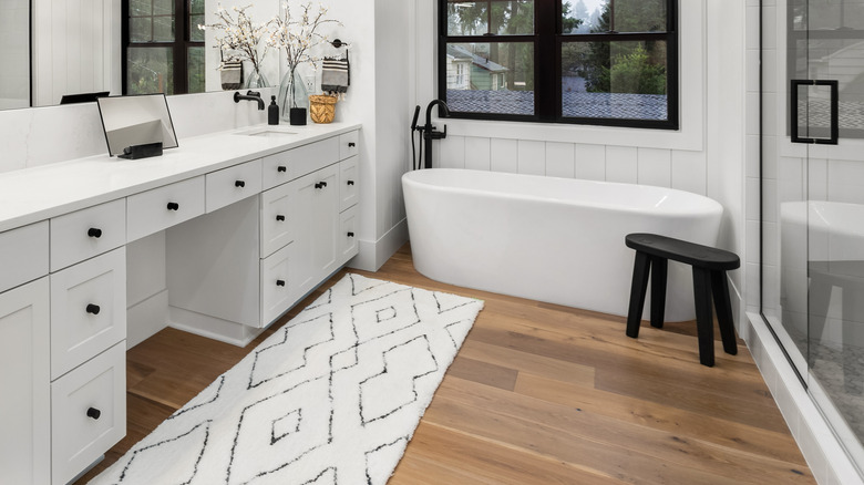Bathroom with wide plank wood flooring